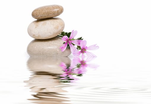 Boulders in zen balance over a white background.