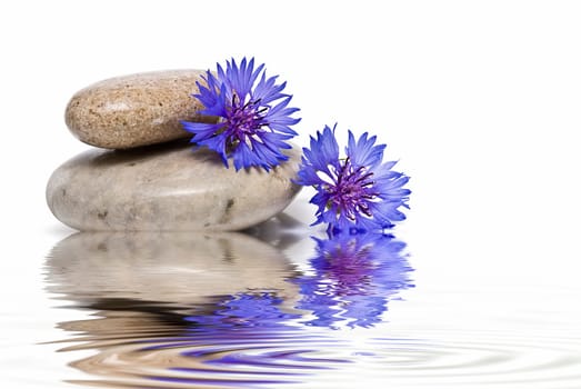 Boulders in zen balance over a white background.