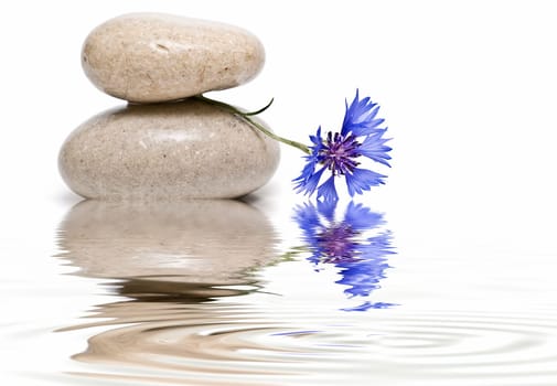 Boulders in zen balance over a white background.