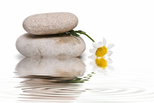 Boulders in zen balance over a white background.
