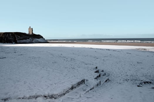 winters beach view of the castle overlooking the beach in ballybunion co kerry ireland