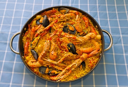 Paella Valenciana, typical food of Spain, based on rice and seafood.