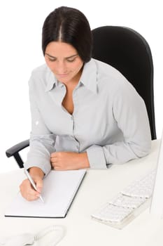 Successful business woman at office thinking sitting table write notepad