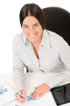 Successful business woman at office smiling working on charts