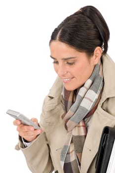 Autumn fashion pretty business woman portrait with phone typing