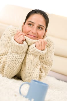 Happy woman and coffee cup wear pullover on white background