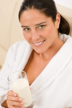 Attractive mid-aged woman drink glass of milk for breakfast portrait