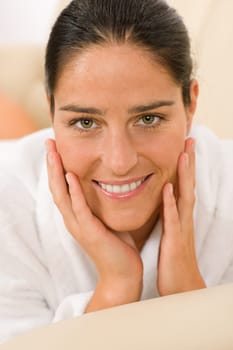 Attractive mid-aged woman facial beauty portrait smiling at camera