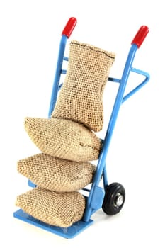 a sack truck loaded with jute sacks
