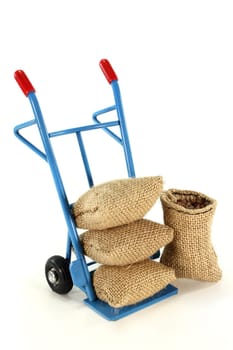 a sack truck loaded with jute sacks