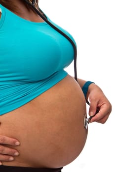 young pregnant woman listening stethoscope of his future child