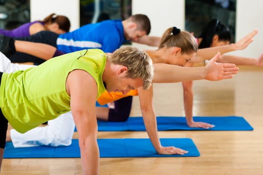 Stretching exercises and gymnastics in the gym