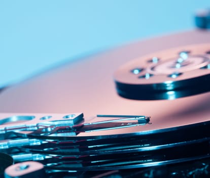 Magnetic disc inside a computer hd unit showing mirror surface of the magnetic discs and read write head