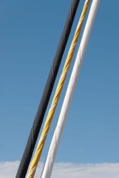three colored nd rolled sails in Padstow in Cornwall