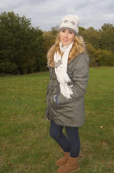 Pretty girl wearing warm clothes on a chilly day