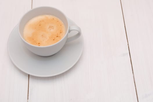 White Cup of Espresso Coffee on Wooden Table