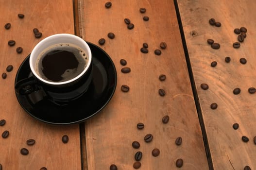 Black Cup of Espresso Coffee on Wooden Table