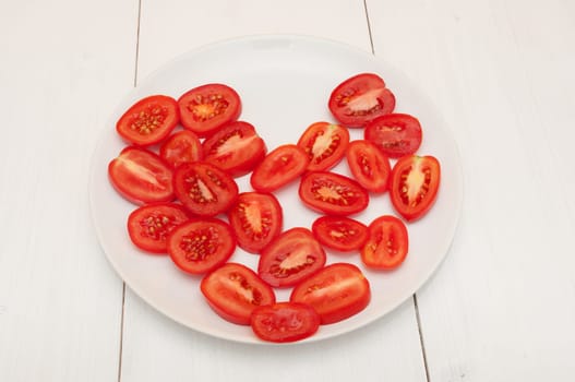 Heart of Fresh Tomatoes on White Plate on Table