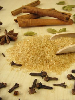 Brown raw cane sugar and spices for baking