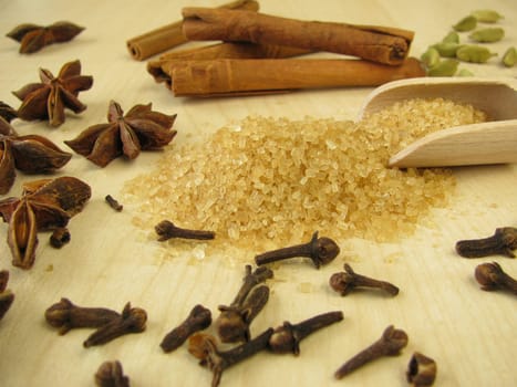 Brown raw cane sugar and spices for baking