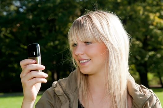 Young woman reading text message