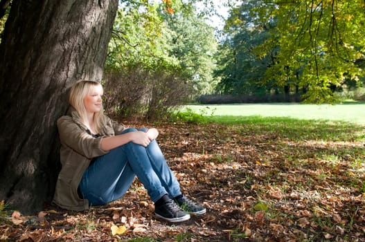 Young woman sitting in the park