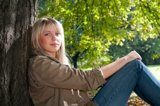 Young woman sitting in the park