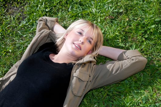 Young woman lying on a meadow