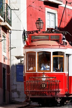 Typical red Tram in Lisbon street, Portugal