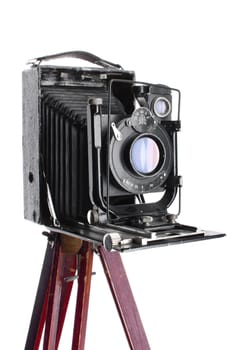 Vintage photocamera was made in 1930 in Soviet Union. Medium format with tripod. Isolated over white background.