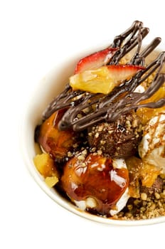 ice cream with chocolate, nuts and caramel close up