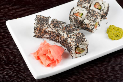 Closeup of Sushi rolls at plate with sesame