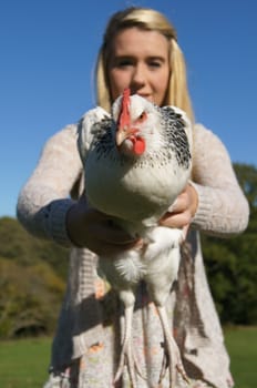 Girl Holding a Chicken
