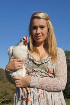 Girl Holding a Chicken
