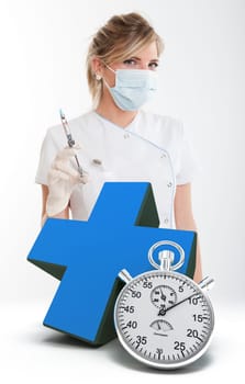 Attractive blonde female dentist holding a syringe