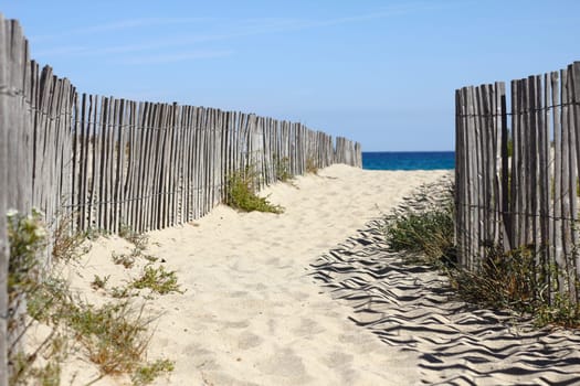 fenced path to the Mediterranean Sea,South of France in summer