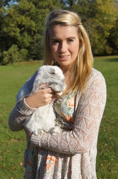 Girl Cuddling Her Pet Rabbit