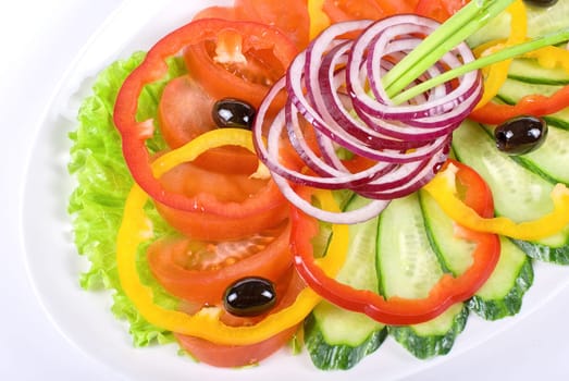 sliced vegetables at the dish isolated on a white