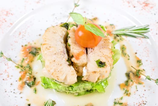 Salad of roasted filet pikeperch with courgette and aubergine, and cherry tomato