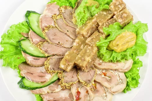 jellied minced meat and meat cuts on green salad