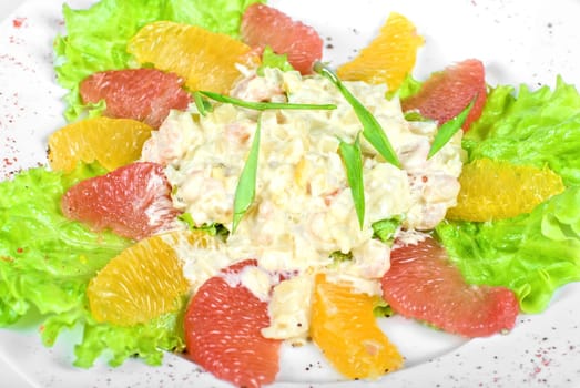 seafood salad of shrimp baked at cream with orange and grapefruit isolated on a white background