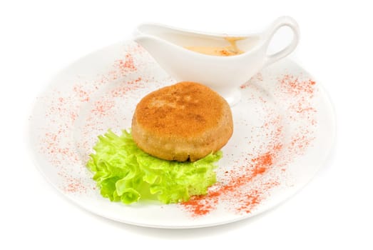 Beef cutlet closeup stuffed with bacon on white plate