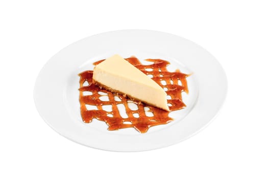 Cheese Cake with honey sauce closeup on white plate