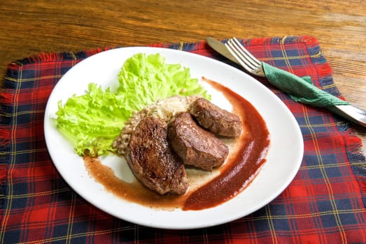 Roast maral meat with blood and garnish pearl barley - very tasty dish