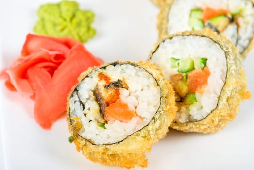 Sushi rolls at plate isolated on a white