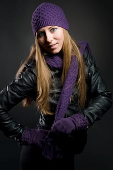 Woman with leather jacket,hat,scarf and gloves