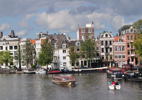 Houses and canal in Amsterdam at summer.