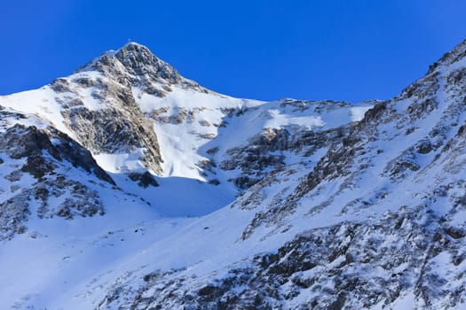 winter mountain landscape with a blue sky, Fagaras Mountains, Romania