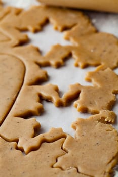 Making gingerbread cookies for Christmas. Gingerbread dough with star shapes.
