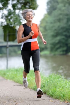 Active senior woman jogging